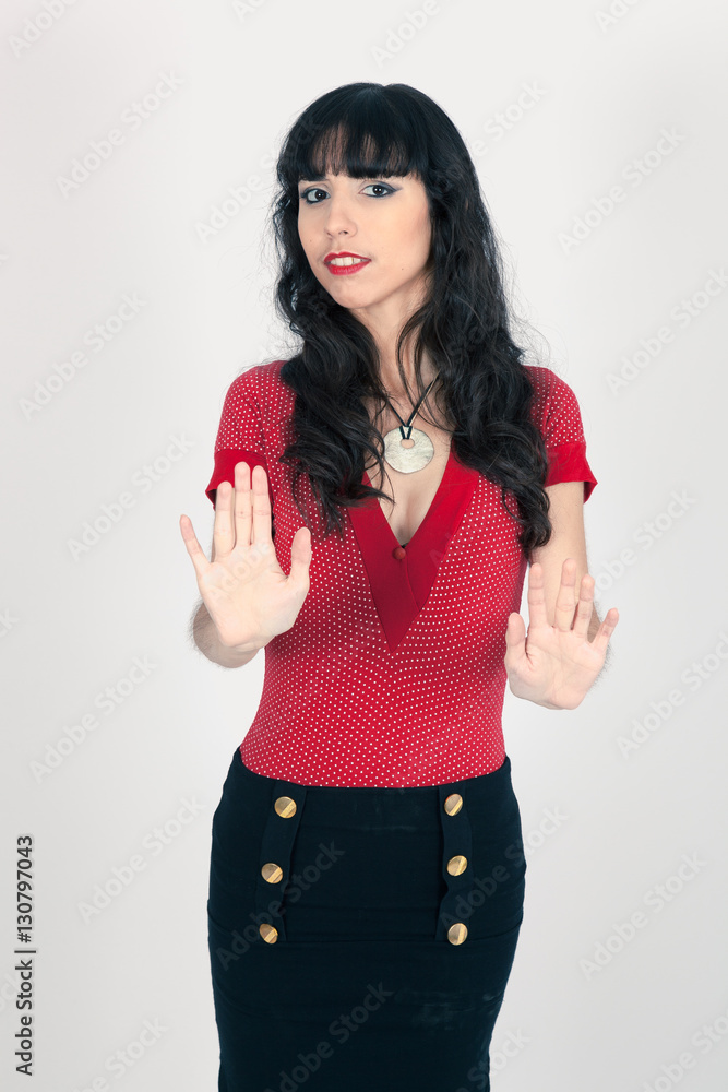 Beautiful woman doing different expressions in different sets of clothes: stop sign Beautiful woman doing different expressions in different sets of clothes: stop sign