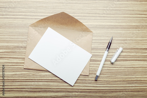 Photo of blank envelope on a wooden background