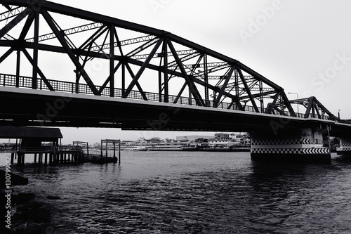 Black and white bridge across a Chao Phraya river 