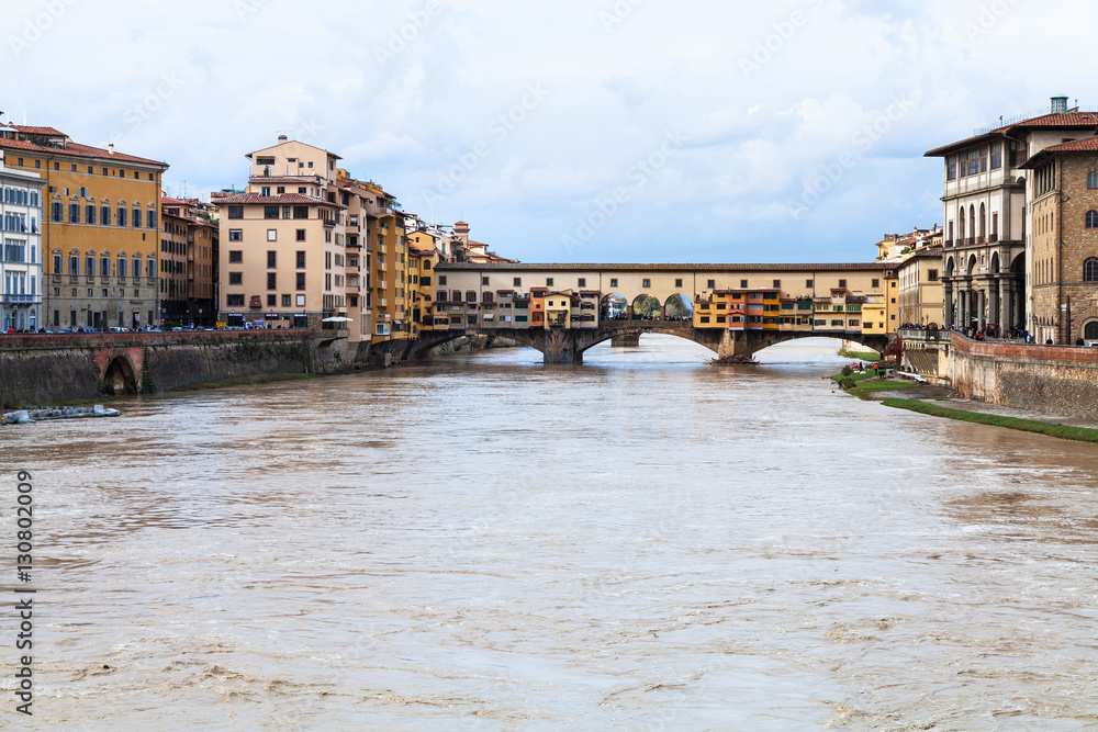 water of Arno river and Ponte Vecchio in autumn