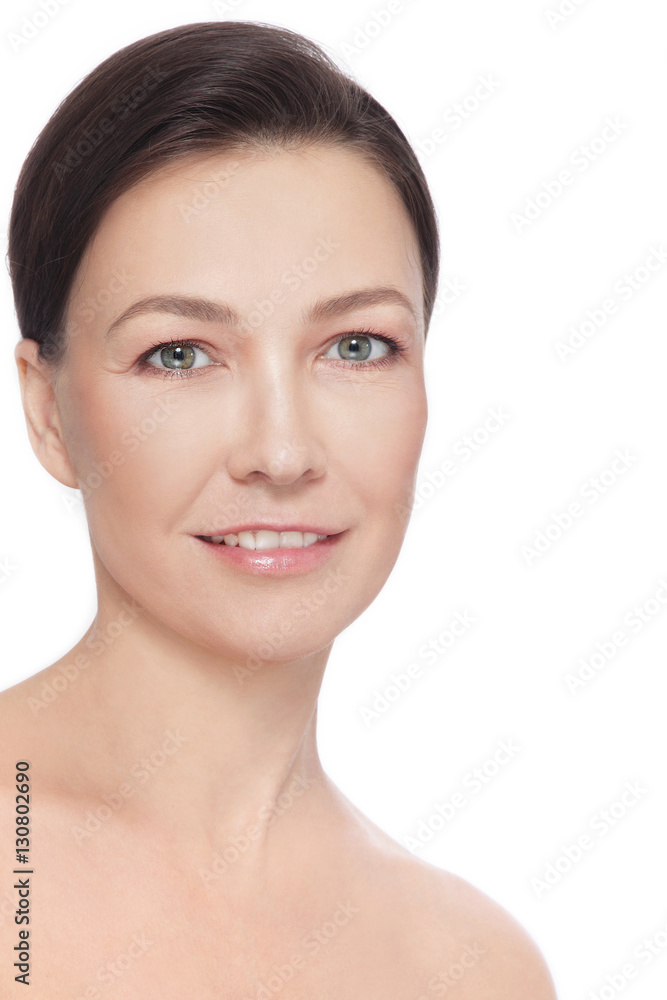 Obraz premium Portrait of beautiful healthy happy smiling mature woman over white background