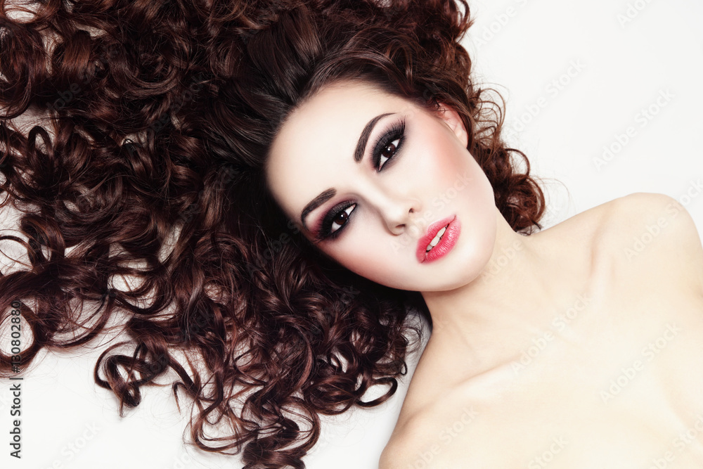 Young beautiful woman with fresh make-up and long curly hair Young beautiful woman with fresh make-up and long curly hair