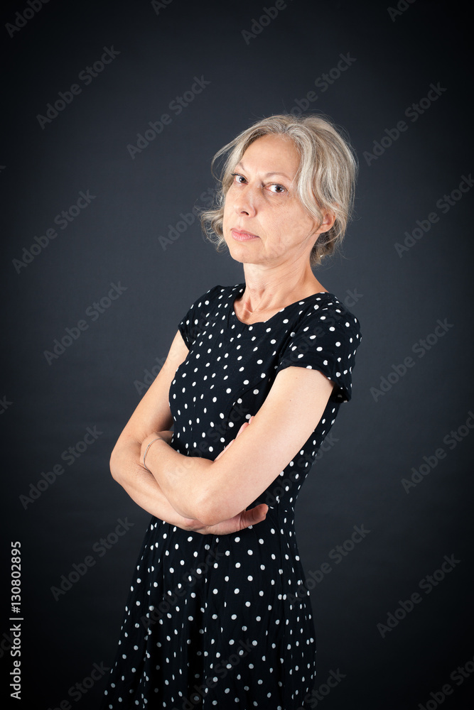 Beautiful woman doing different expressions in different sets of clothes: arms crossed Beautiful woman doing different expressions in different sets of clothes: arms crossed