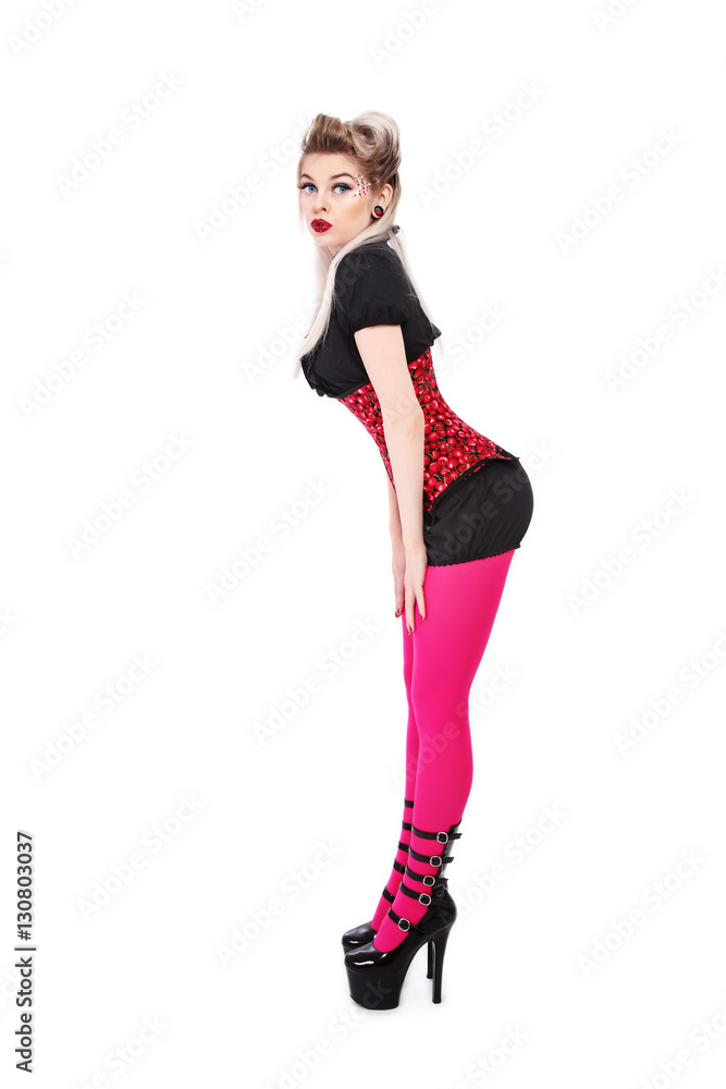 Young beautiful slim sexy blonde girl in fancy corset and stilettos over white background, copy space Young beautiful slim sexy blonde girl in fancy corset and stilettos over white background, copy space