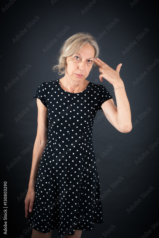 Beautiful woman doing different expressions in different sets of clothes: suicide Beautiful woman doing different expressions in different sets of clothes: suicide