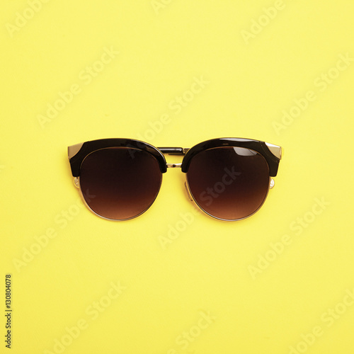 Flat lay. Top view. Fashion sunglasses on pastel background