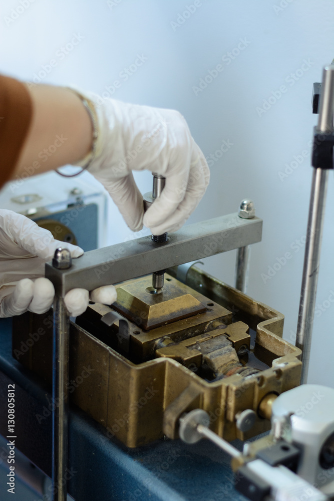 Civil engineer mounting a direct shear test equipment for soil parameters determination.