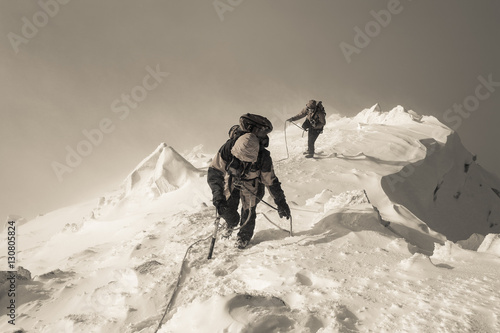 Mountaineering. Teamwork in alpinism.  Traverse of mountain. © Aleks Kend