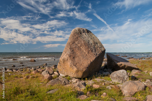 Huge stone on the sea stone beach. © Aleks Kend