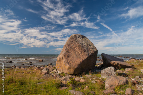 Huge stone on the sea stone beach. © Aleks Kend