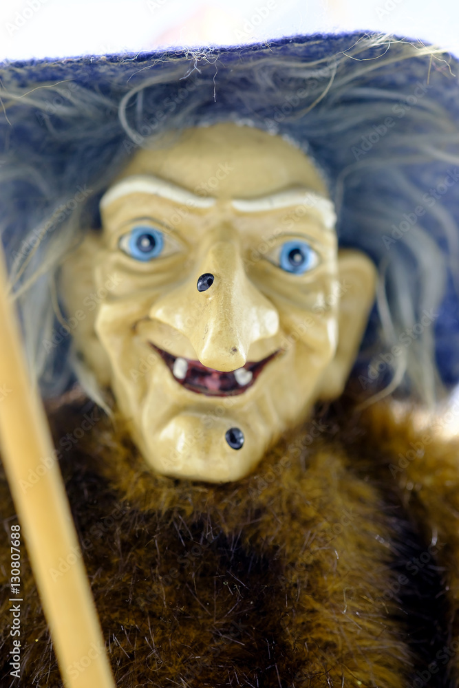 Witch figurine mounted on her broom. Witch figurine mounted on her broom.