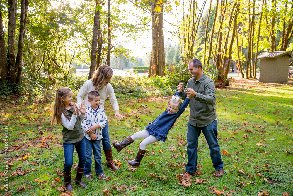 Fototapeta premium Lifestyle Portrait of a Five Person Family Outdoors