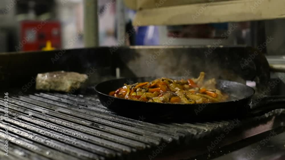 Cooking vegetables and chicken breast fillet in pan Cooking vegetables and chicken breast fillet in pan