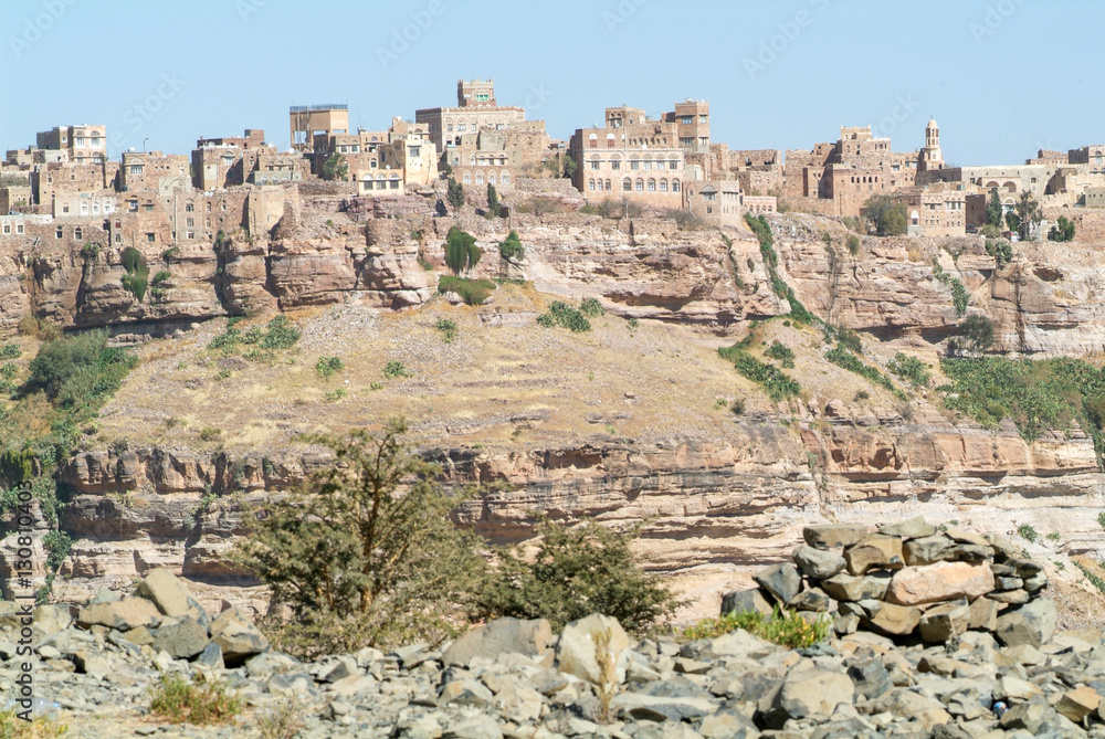 Red rocks and decorated old houses of Kawkaban fortified city Red rocks and decorated old houses of Kawkaban fortified city