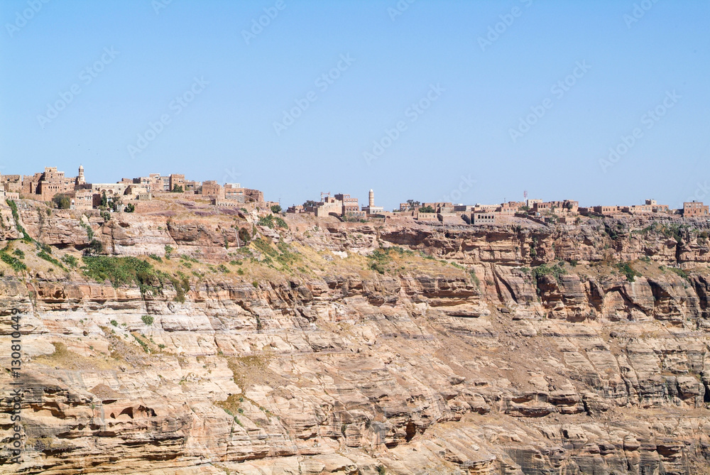 Red rocks and decorated old houses of Kawkaban fortified city Red rocks and decorated old houses of Kawkaban fortified city