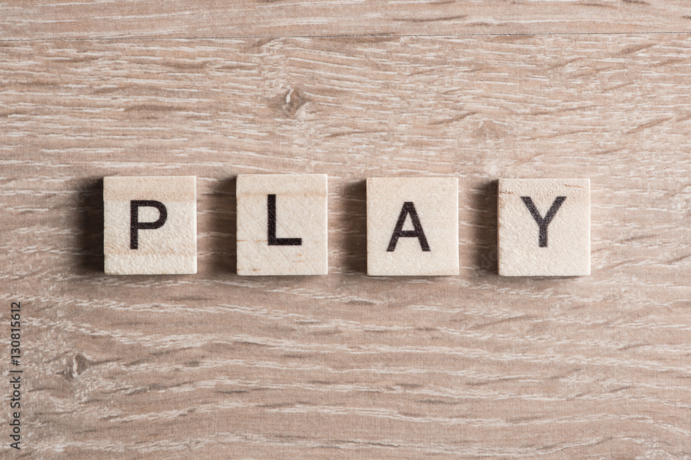 Fototapeta premium wooden elements with letter collected to word play