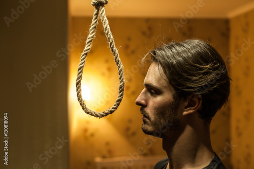 Fototapeta Desperate man preparing to commit suicide