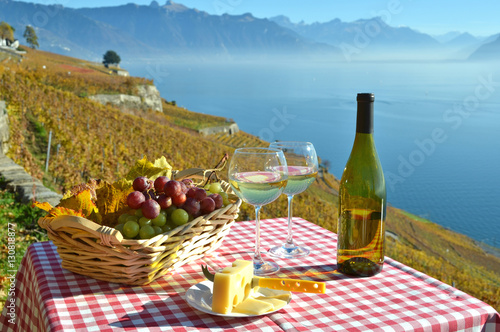 Wine and grapes against Geneva lake, Switzerland