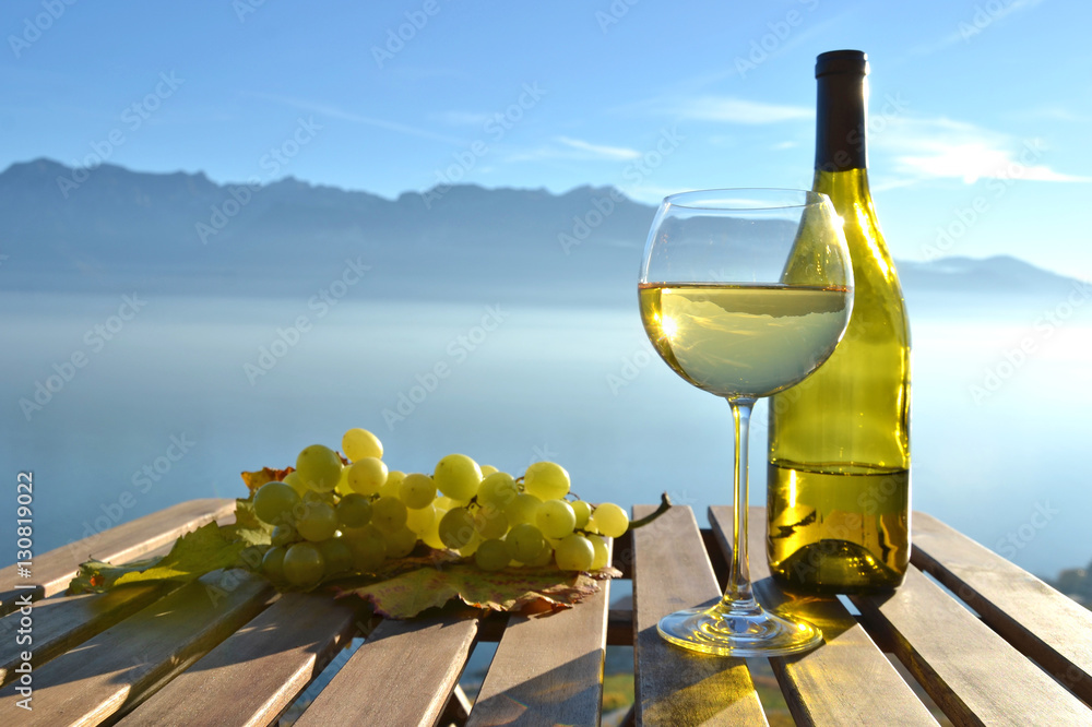 Wine and grapes against Geneva lake, Switzerland