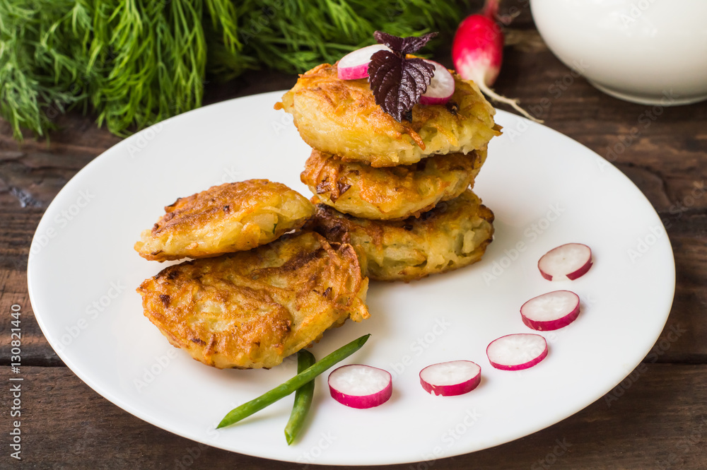 Potato pancakes for breakfast. Wooden rustic background