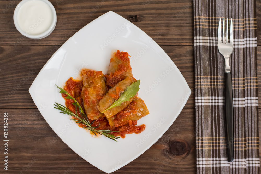 Stuffed cabbage with buckwheat. Old background. Top view. Close-up Stuffed cabbage with buckwheat. Old background. Top view. Close-up