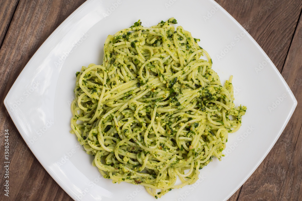 Pasta with pesto Brazilian. Wooden table. Top view