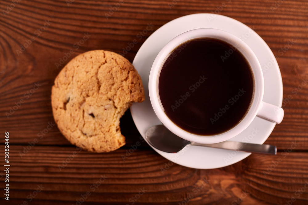 Coffee and Homemade cookies with chocolate. Handmade Chocolate cookies and cup of espresso on wooden table. Pile of delicious chip cookies. Christmas cookies. Biscuits. Oat biscuits. Coffee and Homemade cookies with chocolate. Handmade Chocolate cookies and cup of espresso on wooden table. Pile of delicious chip cookies. Christmas cookies. Biscuits. Oat biscuits.