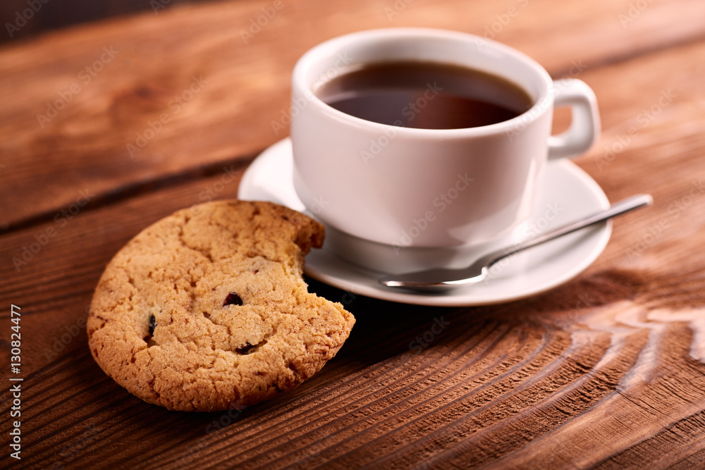 Coffee and Homemade cookies with chocolate. Handmade Chocolate cookies and cup of espresso on wooden table. Pile of delicious chip cookies. Christmas cookies. Biscuits. Oat biscuits. Coffee and Homemade cookies with chocolate. Handmade Chocolate cookies and cup of espresso on wooden table. Pile of delicious chip cookies. Christmas cookies. Biscuits. Oat biscuits.