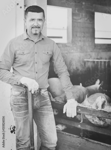 Man working on animal farm photo