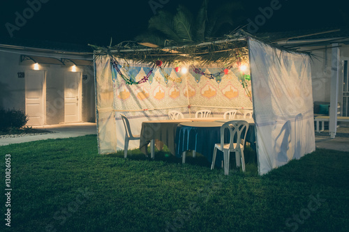 Sukkah - symbolic temporary hut for celebration of Jewish Holiday Sukkot photo