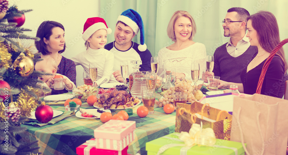 family celebrates Christmas at  table