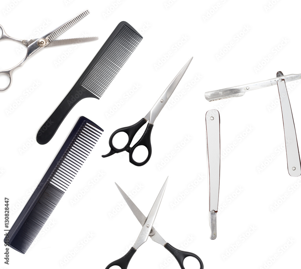 Comb with scissors and razor on a white background