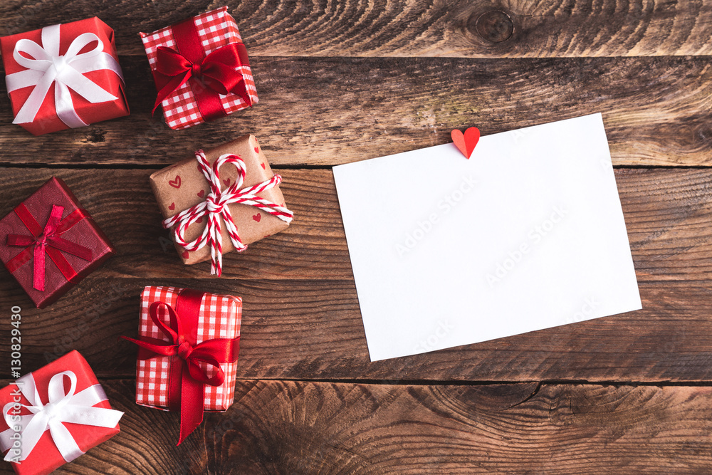 Greeting card or photo frame and valentines day felt toy heart over wooden background Greeting card or photo frame and valentines day felt toy heart over wooden background