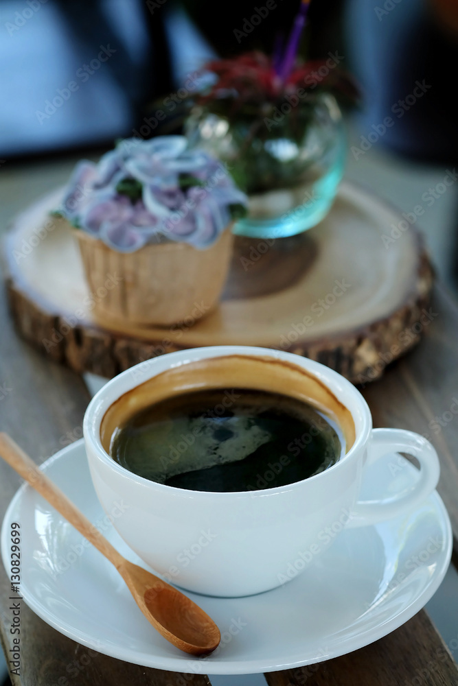 Blue cupcake design cream like blue Hydrangea flower Served with hot black coffee on wooden table background and have some space for write wording Blue cupcake design cream like blue Hydrangea flower Served with hot black coffee on wooden table background and have some space for write wording