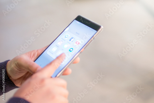 Wallpaper Mural Woman Hands touching smartphone for social network Torontodigital.ca