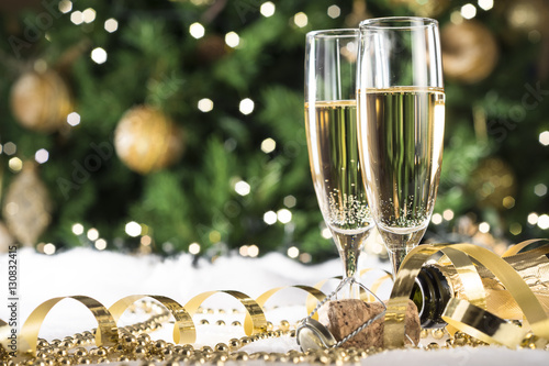 New Year champagne , Christmas tree background, snow