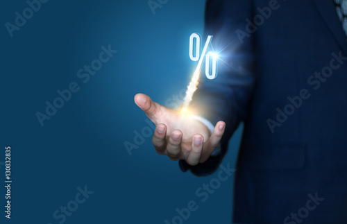 Businessman represents the Start of the percentage discounts. Concept sale.