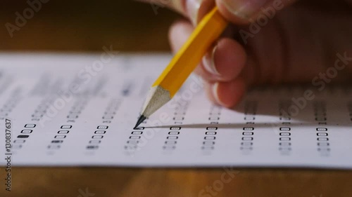 4K Close up of pencil being used on a multiple choice test paper