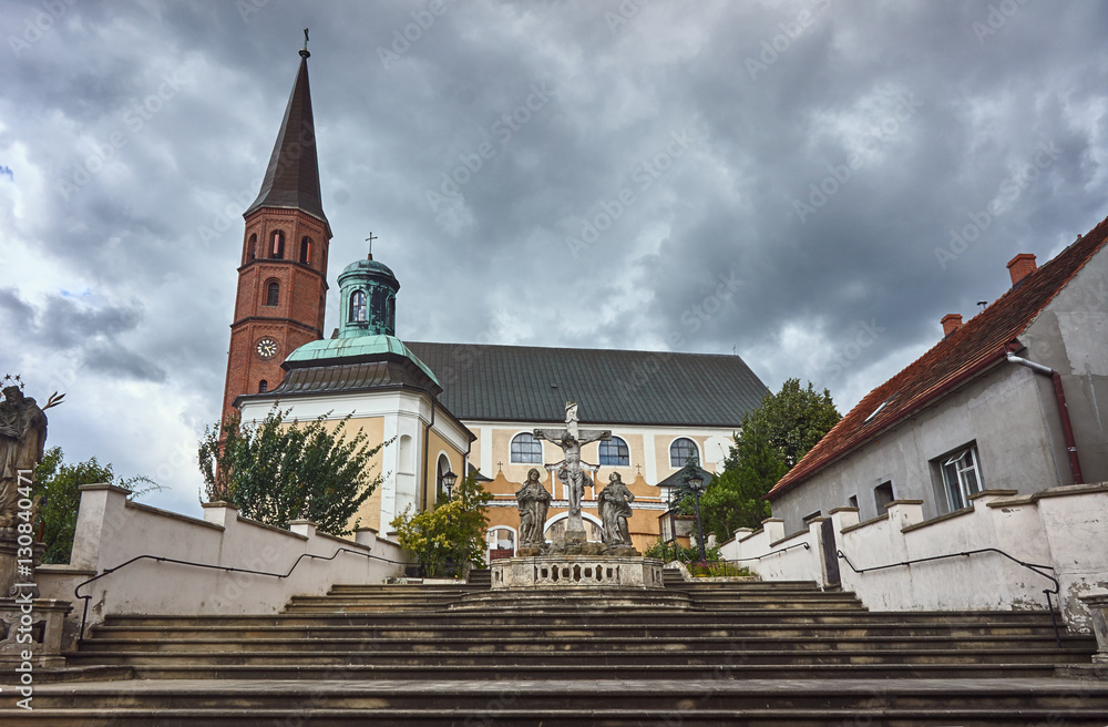 Obraz premium Baroque sculpture on the steps of the church in Grodowcu, Poland.