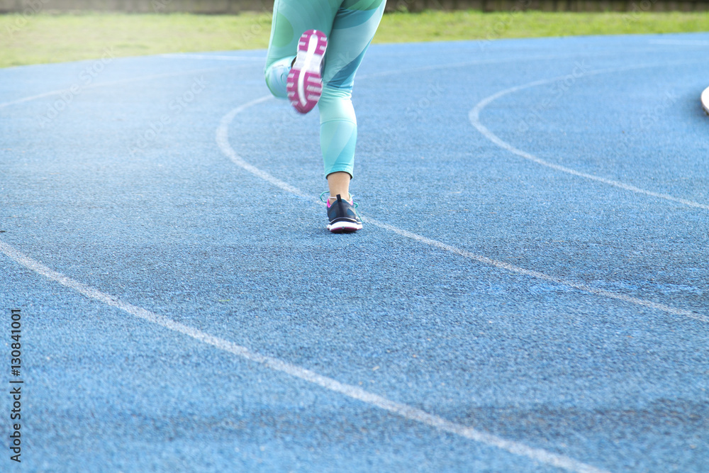 Fototapeta premium Woman running on track