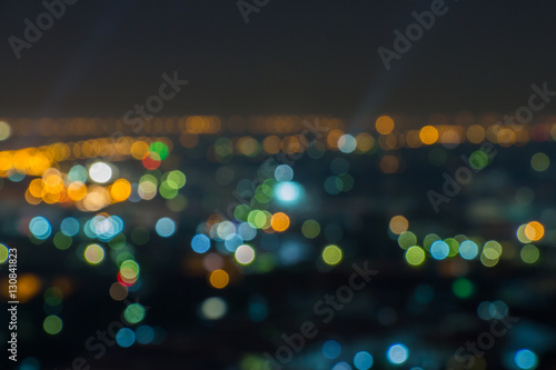 Night life in cityscape with search lights and lots of venues op © Travis