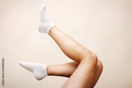 Woman legs in white socks