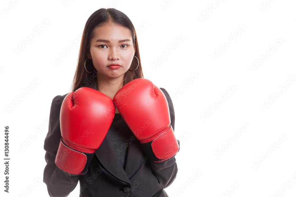 Young Asian business woman with red boxing gloves. Young Asian business woman with red boxing gloves.