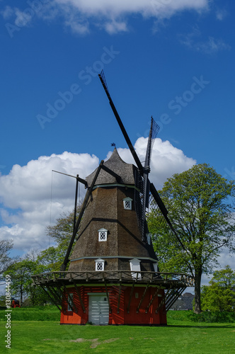 Red wooden windmill in Kastellet fortress (The old military fortress), Copenhagen, Denmark © smoke666