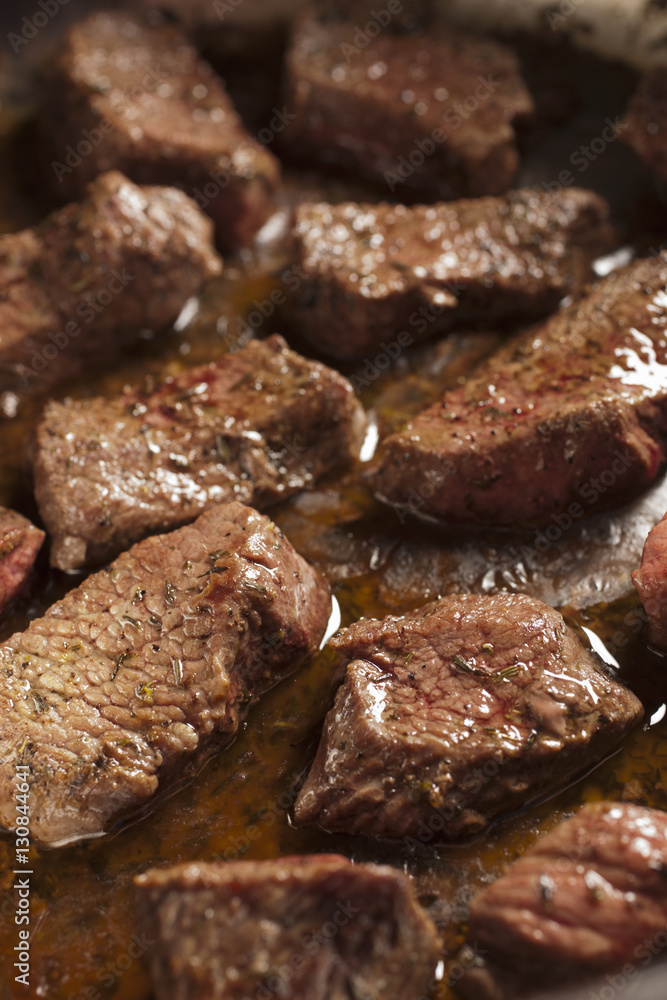 beef pieces browning in a pot beef pieces browning in a pot
