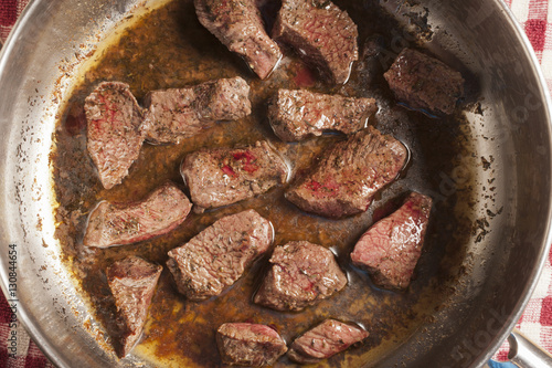 beef pieces browning in a pot