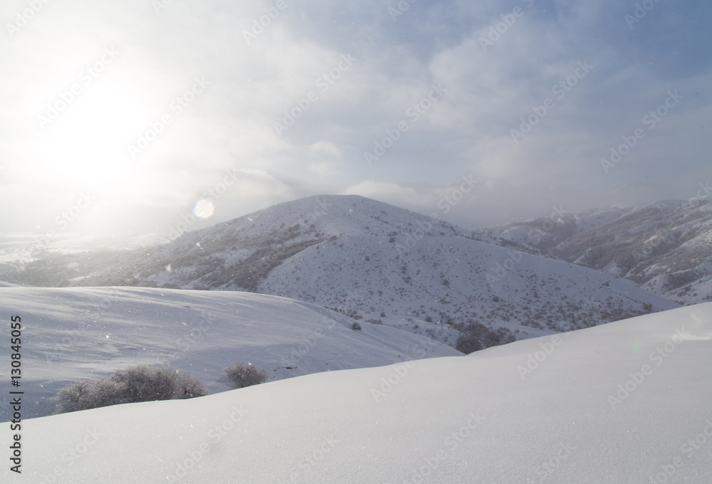 dawn sun in the snowy mountains of Kazakhstan