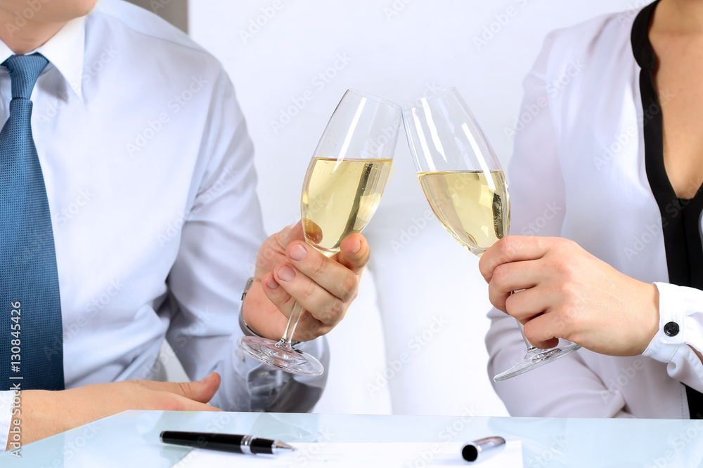 two business partners / colleagues celebrate signing a contrac two business partners / colleagues celebrate signing a contrac