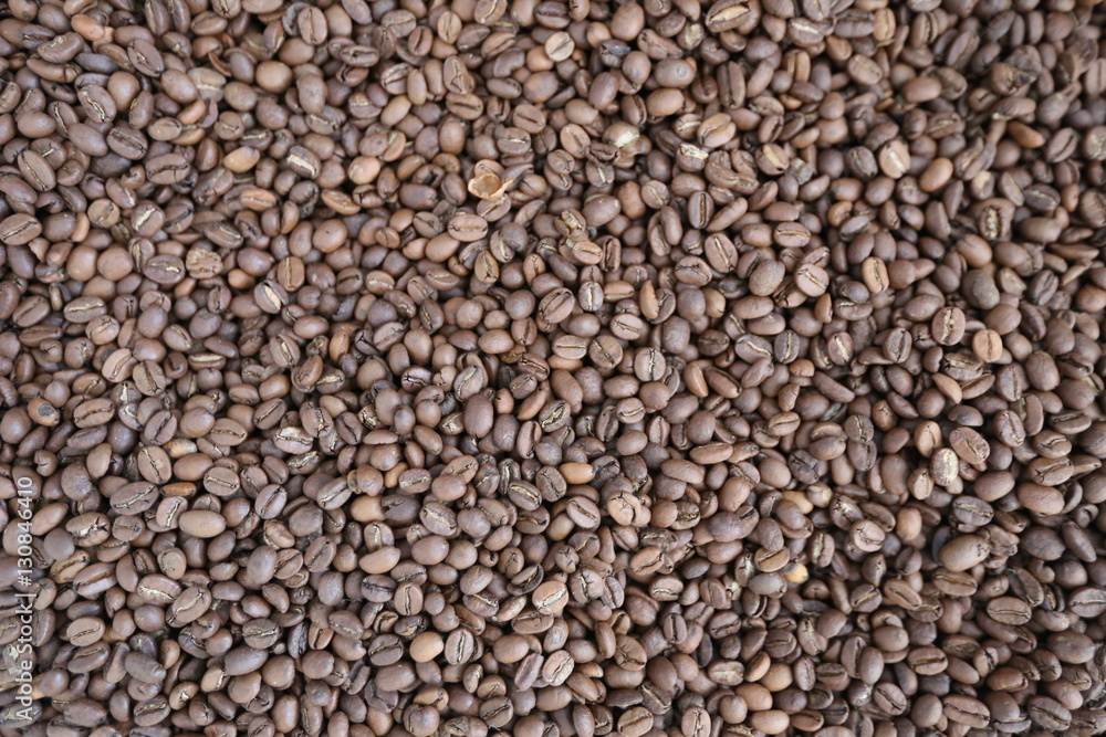 Roasted brown coffee beans background, above view. Coffee beans texture Roasted brown coffee beans background, above view. Coffee beans texture