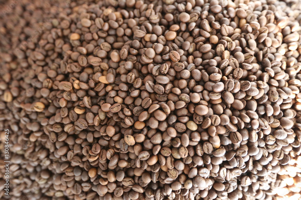Roasted brown coffee beans background, above view. Coffee beans texture Roasted brown coffee beans background, above view. Coffee beans texture